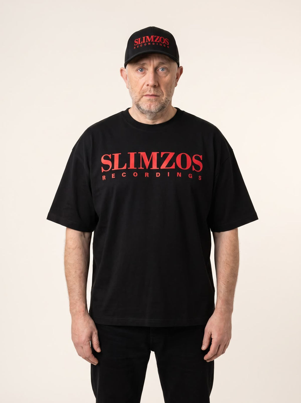 Slimzee wearing the black Slimzos tee