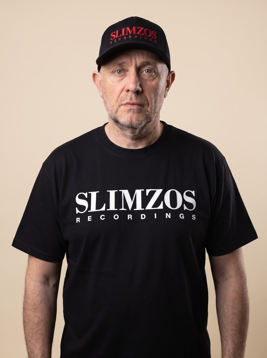 Slimzee wearing the black Slimzos tee, white print