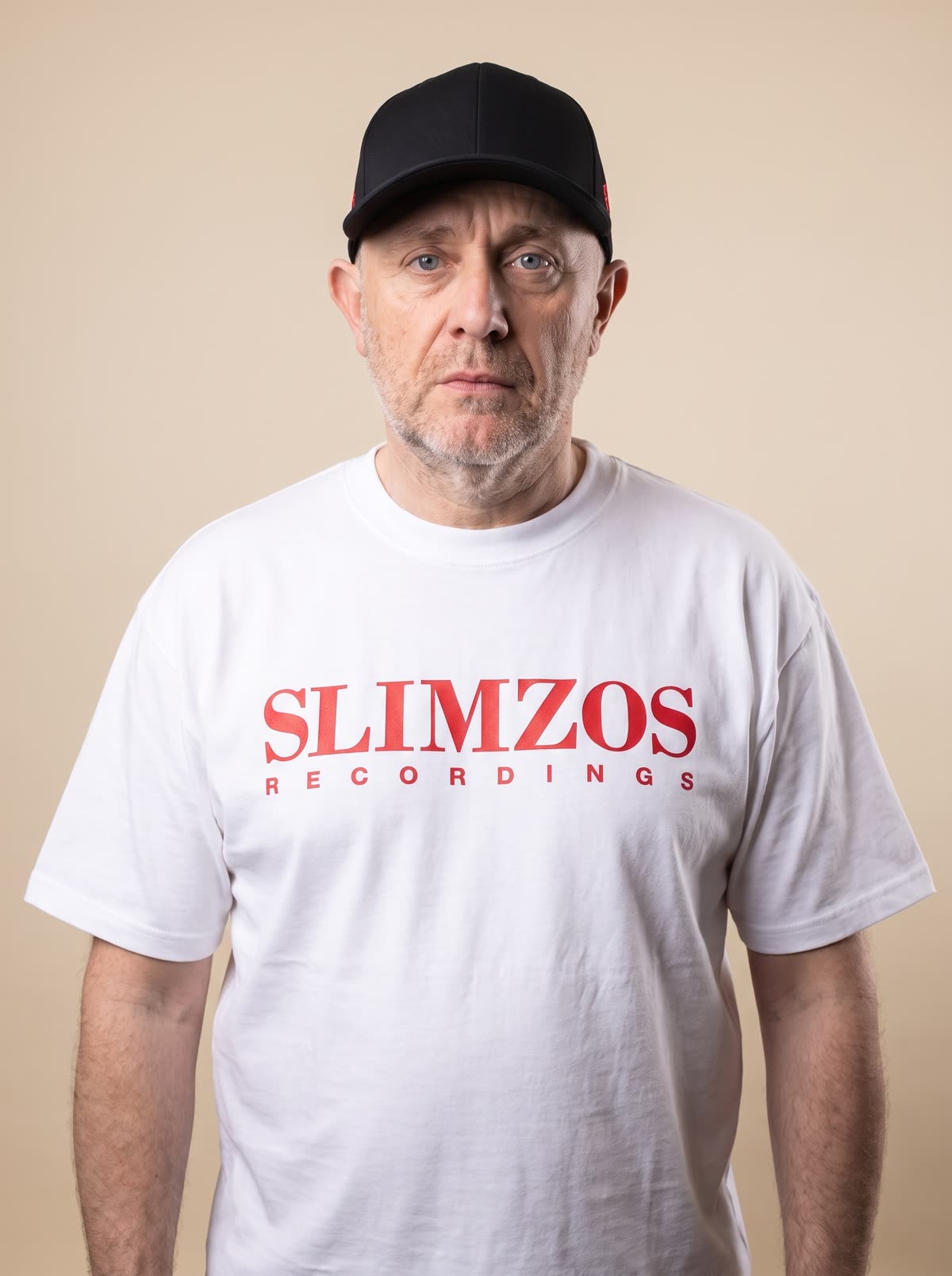 Slimzee wearing the white Slimzos tee, red print